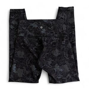 Lululemon black high-waisted leggings with metallic foil print
